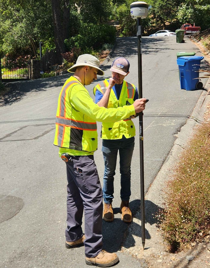 Two field workers using Trimble R2 GNSS