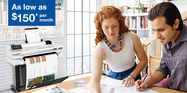 woman and man looking at architecture plans with a wide format printer in the background