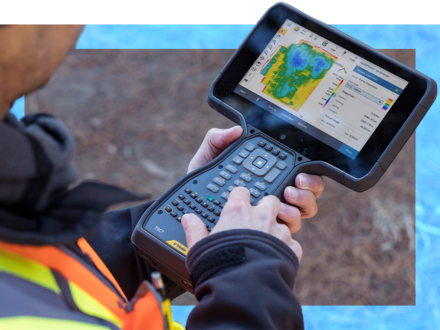field surveyor holding TSC7 data collector