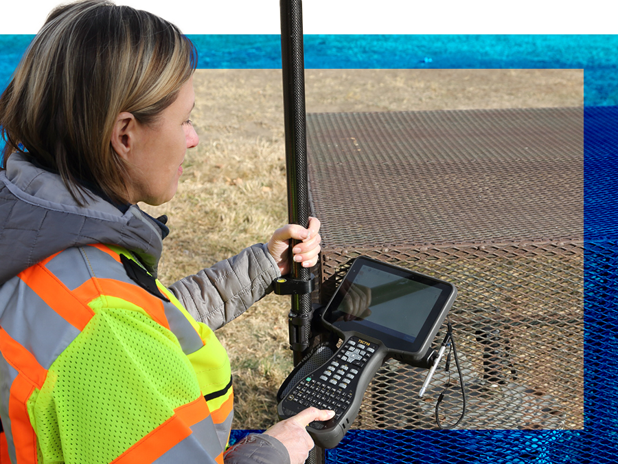 field surveyor holding TSC710 data collector