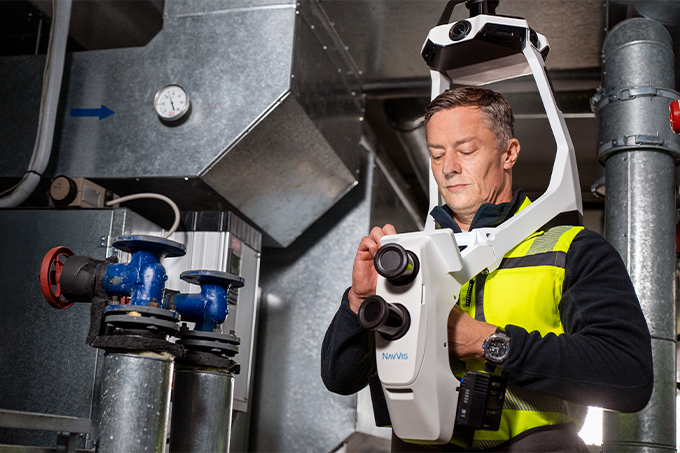 field worker using NavVis VLX 4 inside utility room