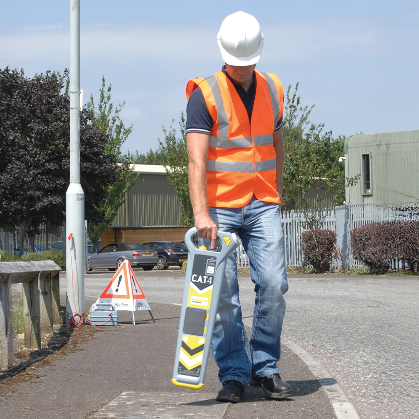 field worker scanning city sidewalk with C.A.T.