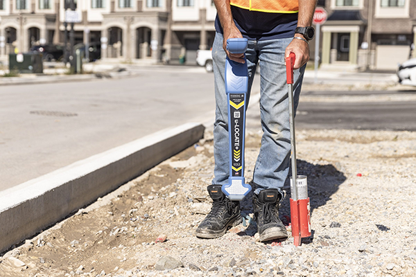 field worker locating and marking underground assets