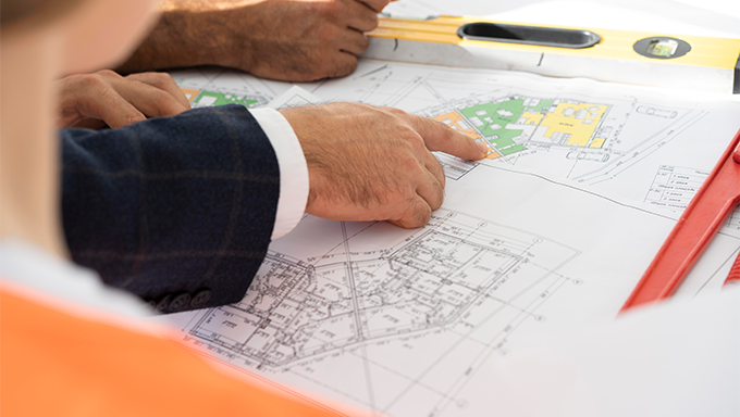 conslutant pointing a engineer plans