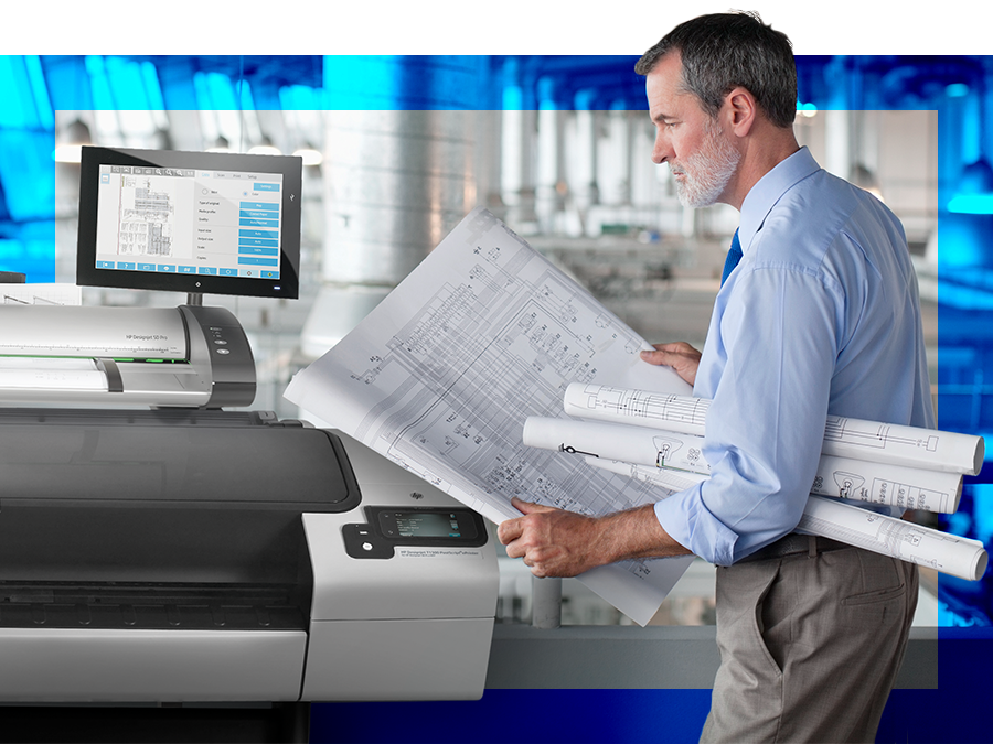 engineer holding large document plans