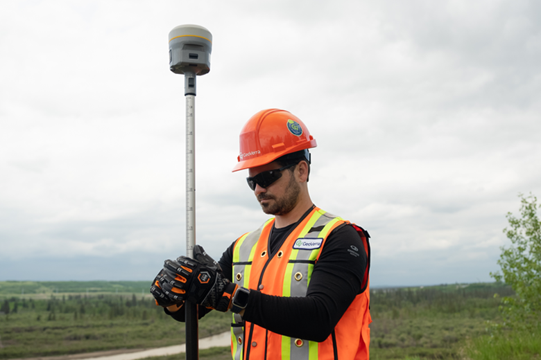 field worker using Trimble Ri GNSS antenna
