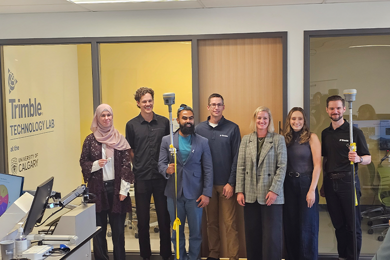 students accepting new GNSS equipment