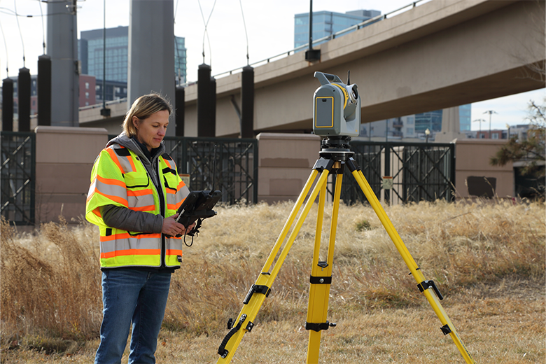 female field surveyor using Trimble SX12 TS