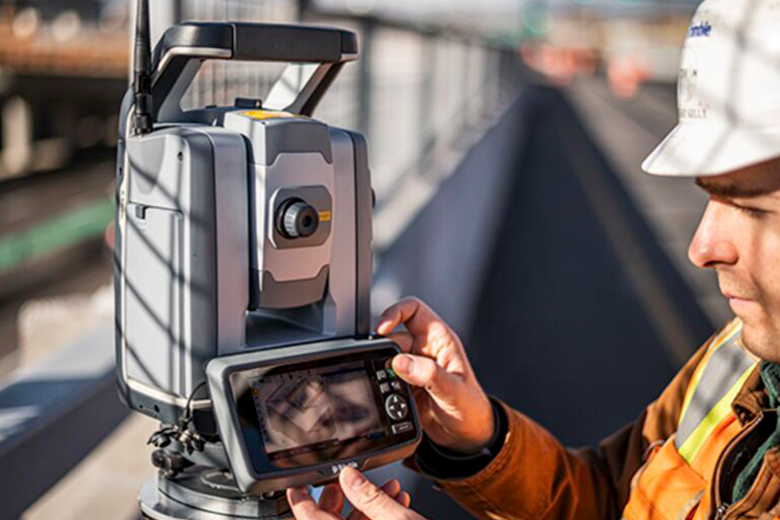 field worker using Trimble TS